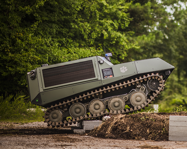 Deep Orange 13 Tracked Vehicle navigating through the woods