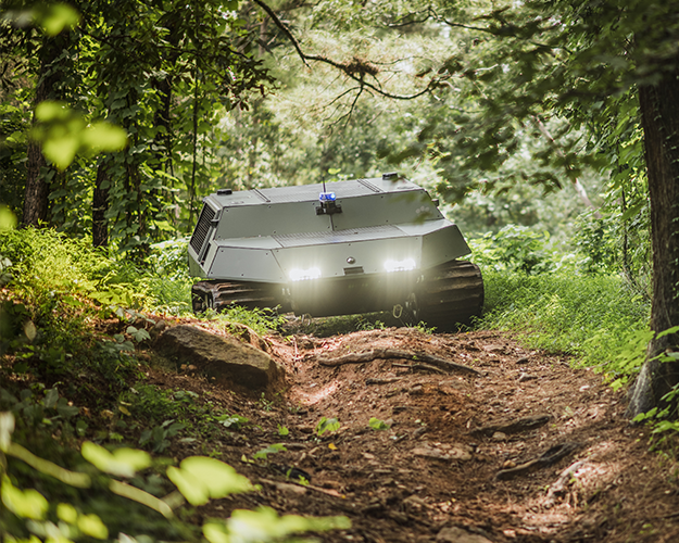 Deep Orange 14 Tracked Vehicle navigating through the woods