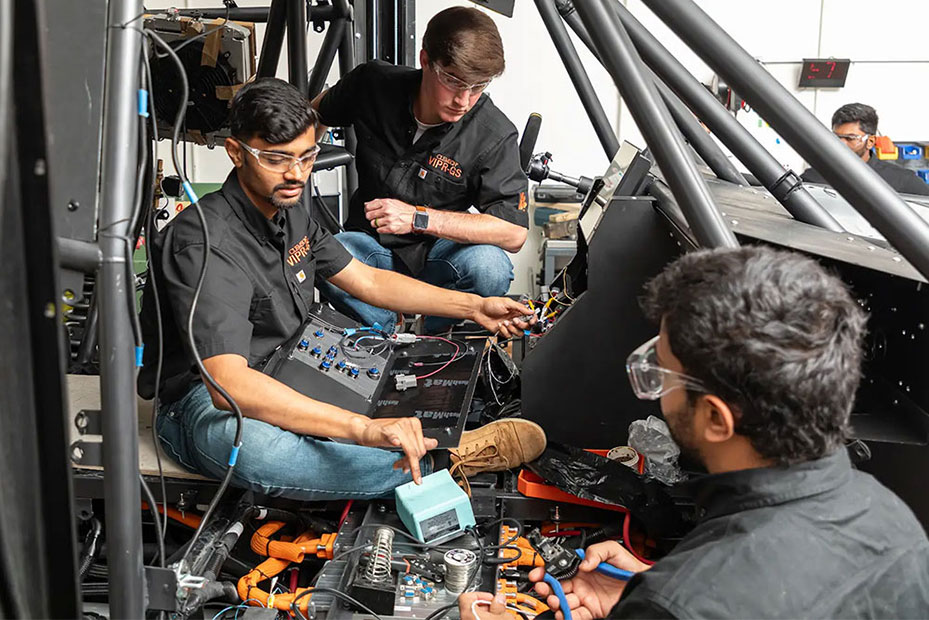 Students working on vehicle planning systems