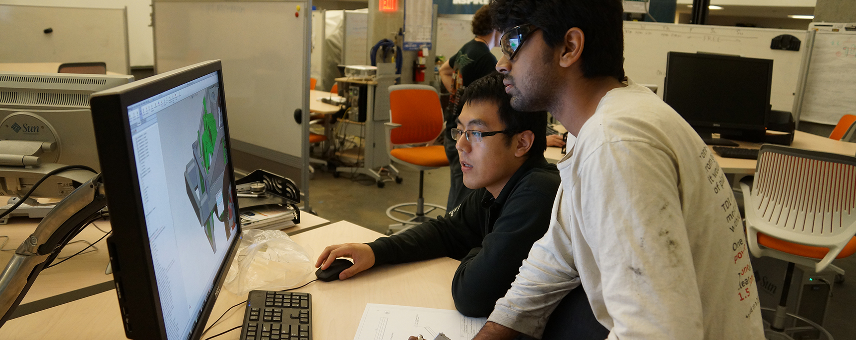 Student studying vehicle diagram on monitor