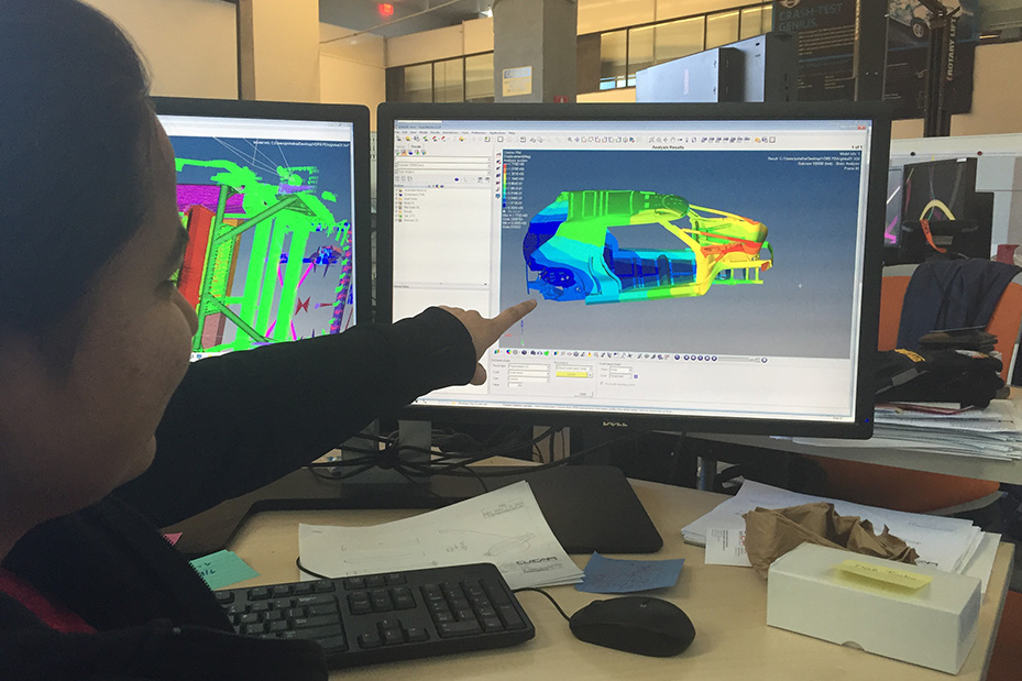 Student studying vehicle diagram on monitor