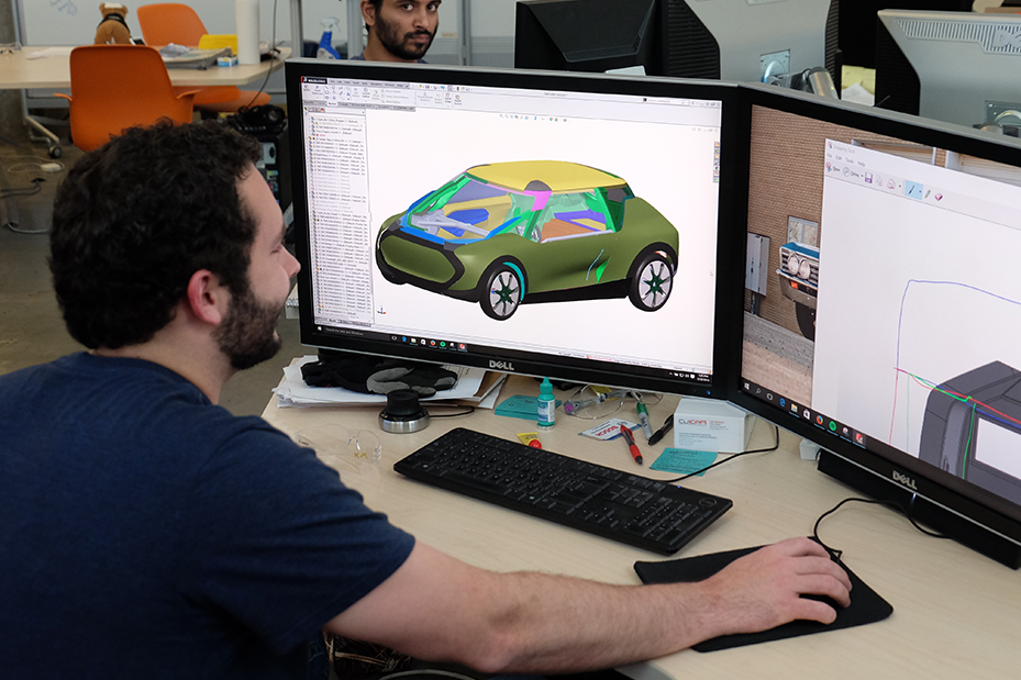 Student studying digital car model