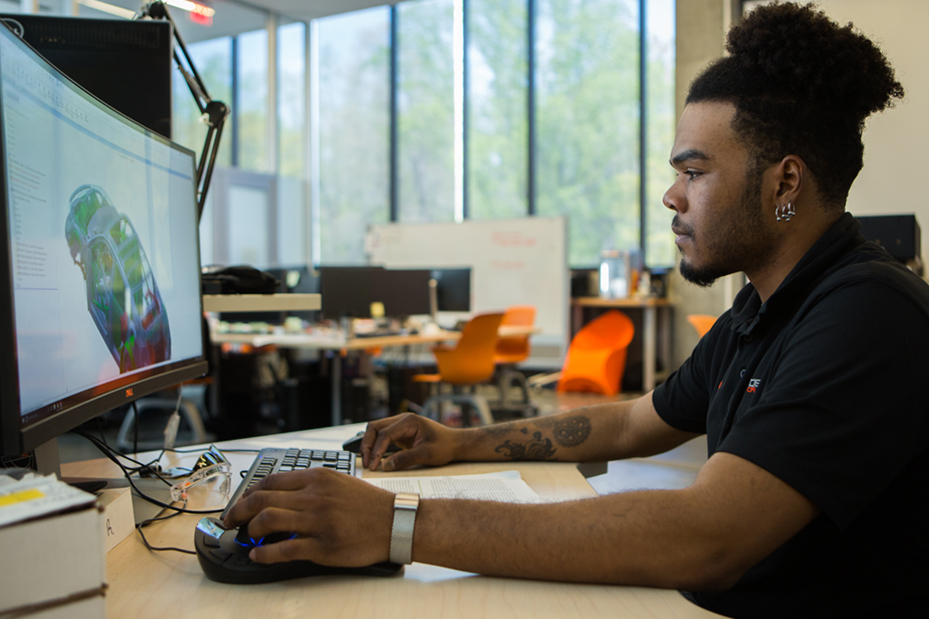 Student studying vehicle diagram on monitor