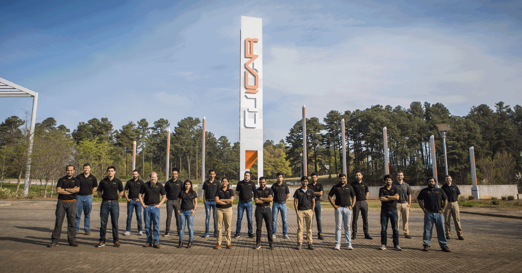DO9 Team standing in front of the CU-ICAR Sign