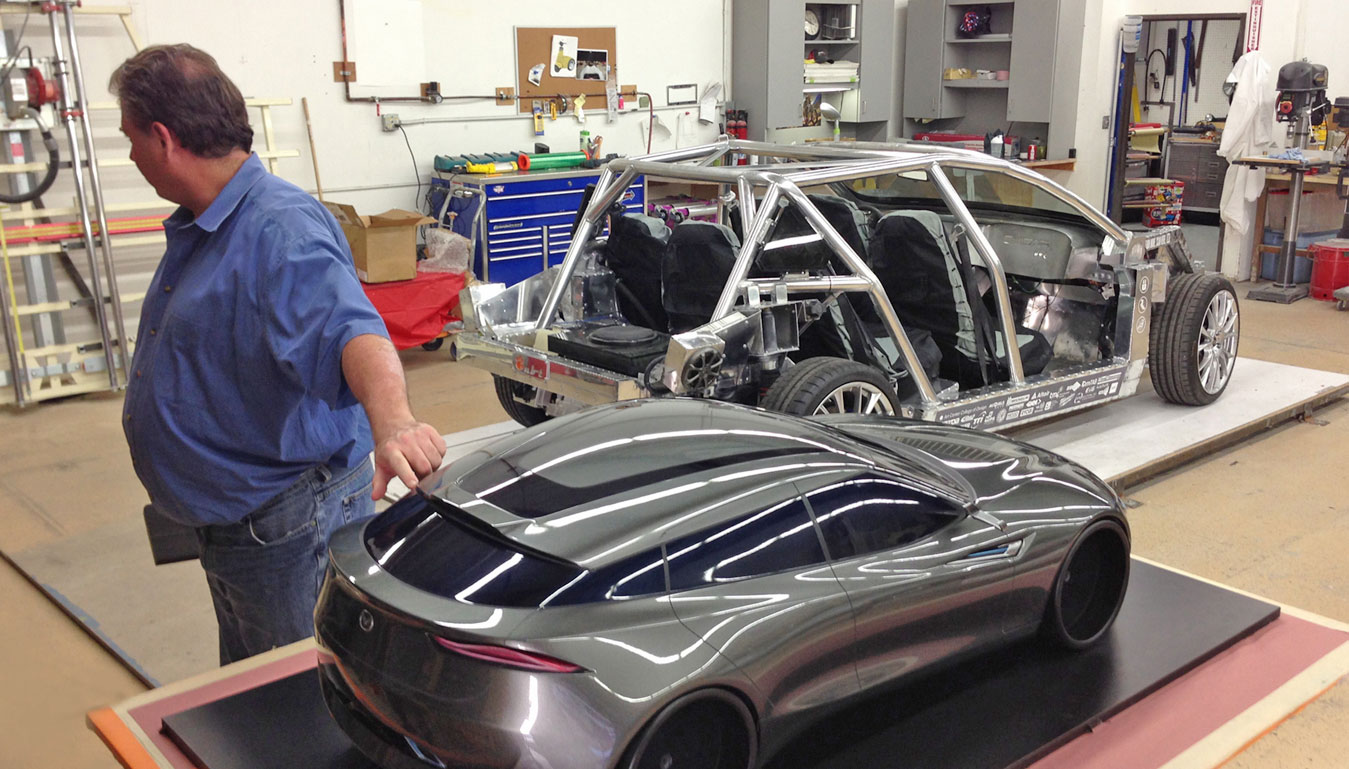 Staff member inspects concept model