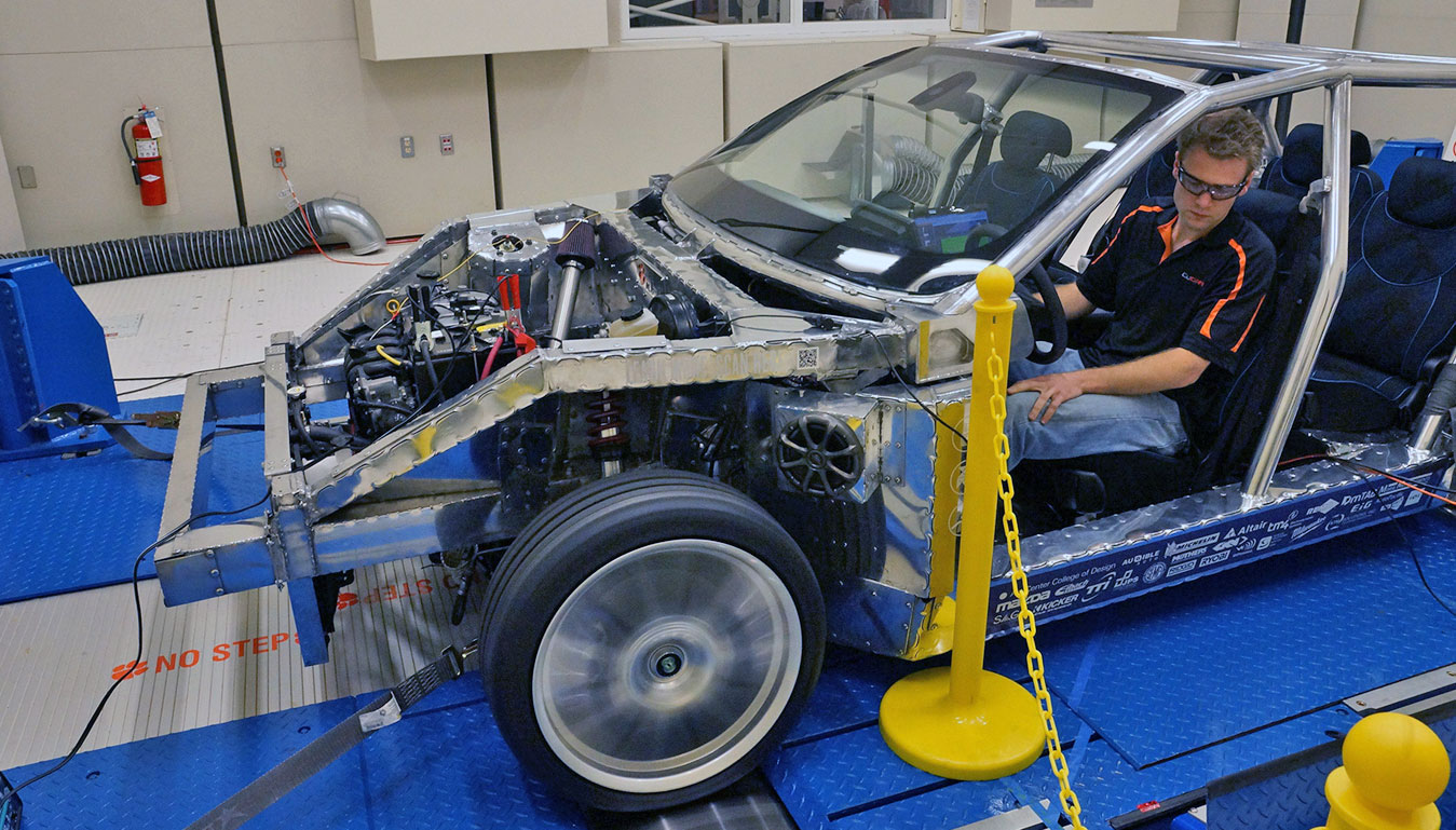 Student sits inside a concept vehicle as it is tested