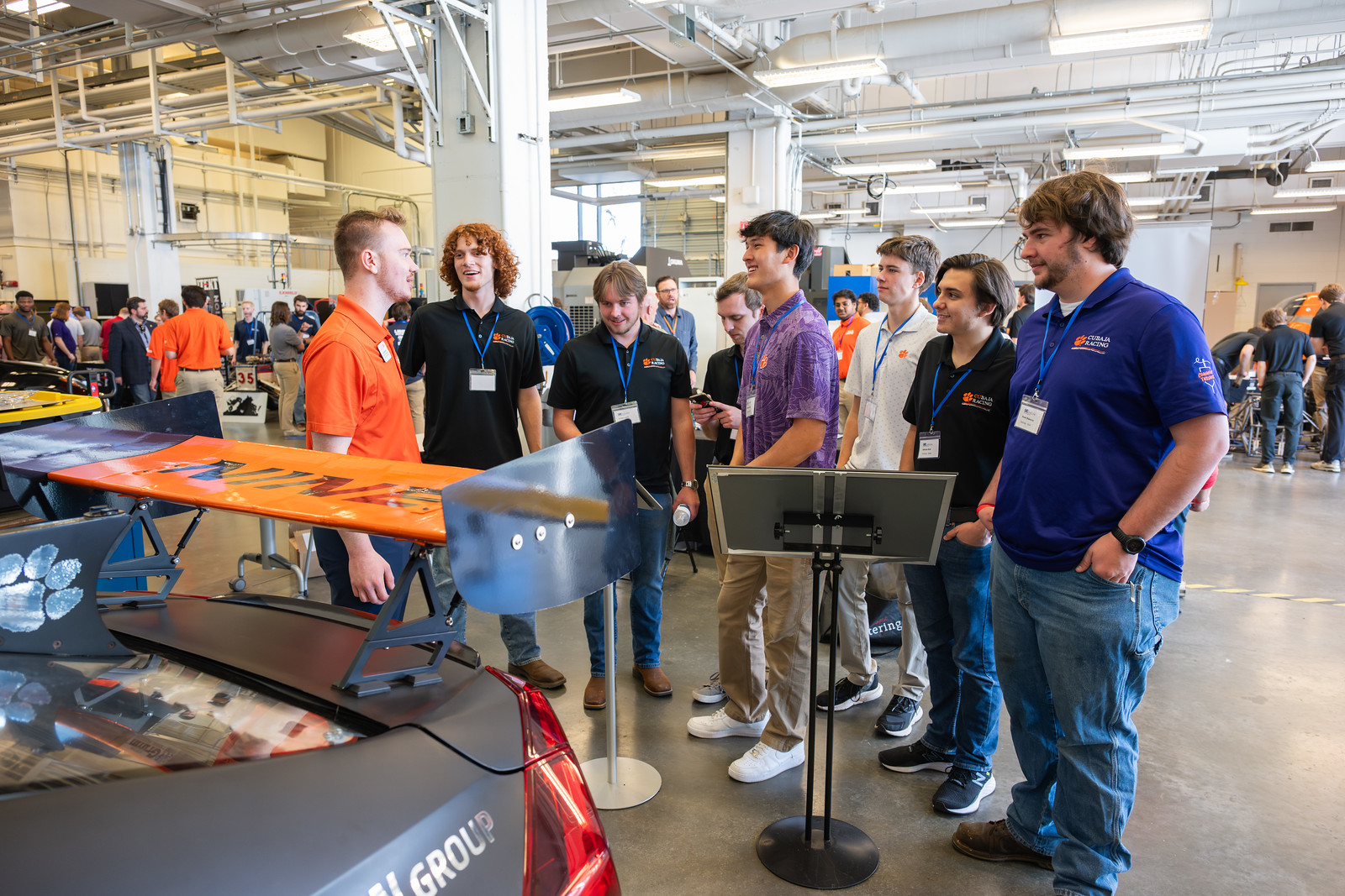 People touring the inside of the CUICAR facilities.