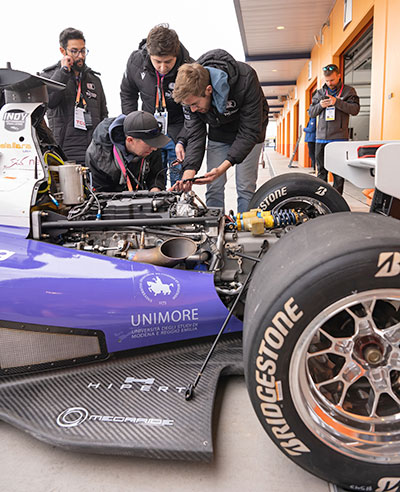 Group of students working on Indy car 