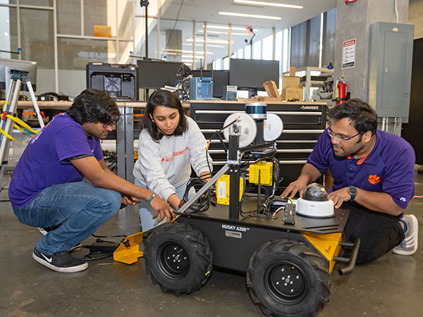 Graduate students working on autonomous technology research in Greenville.