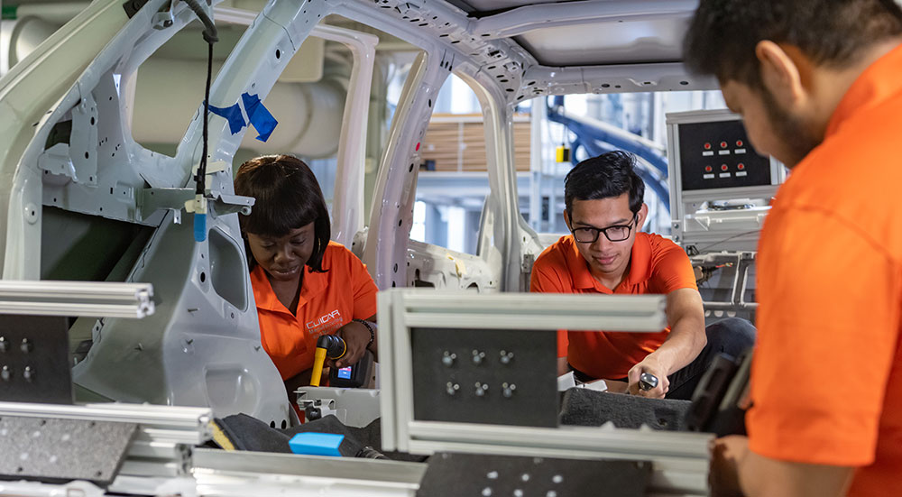 Students getting hands-on experience in automotive research.