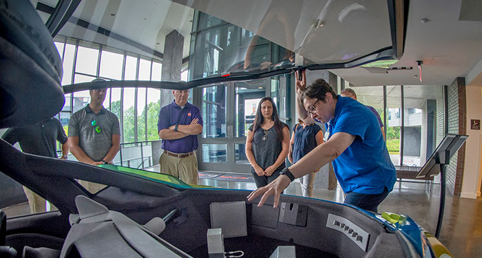 People touring the inside of the CUICAR facilities.