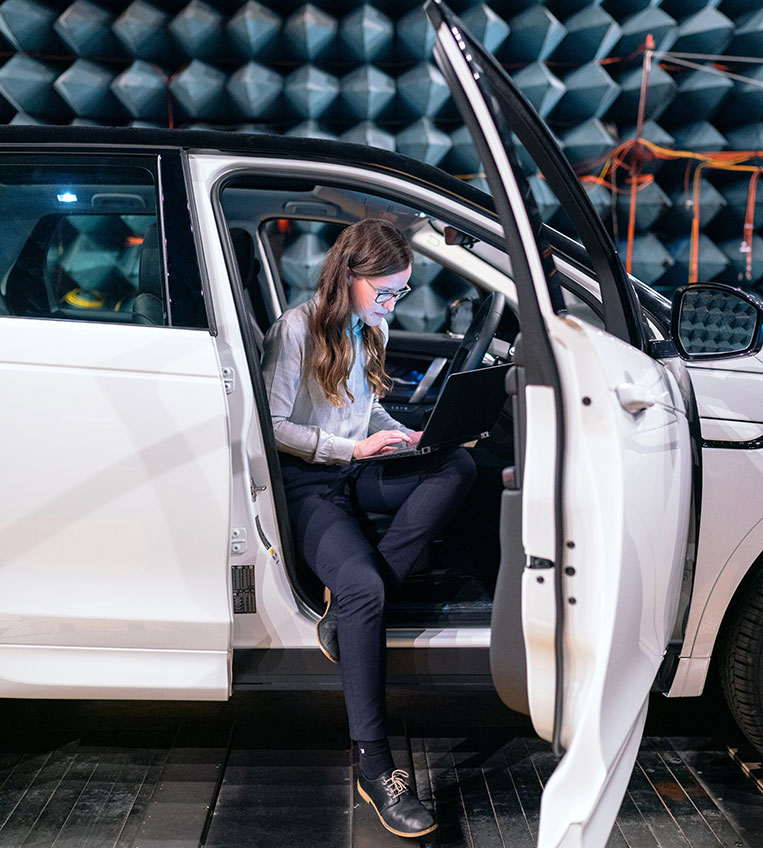 Employees using laptop to access vehicle information..