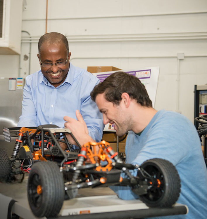 Professor and student in lab working.