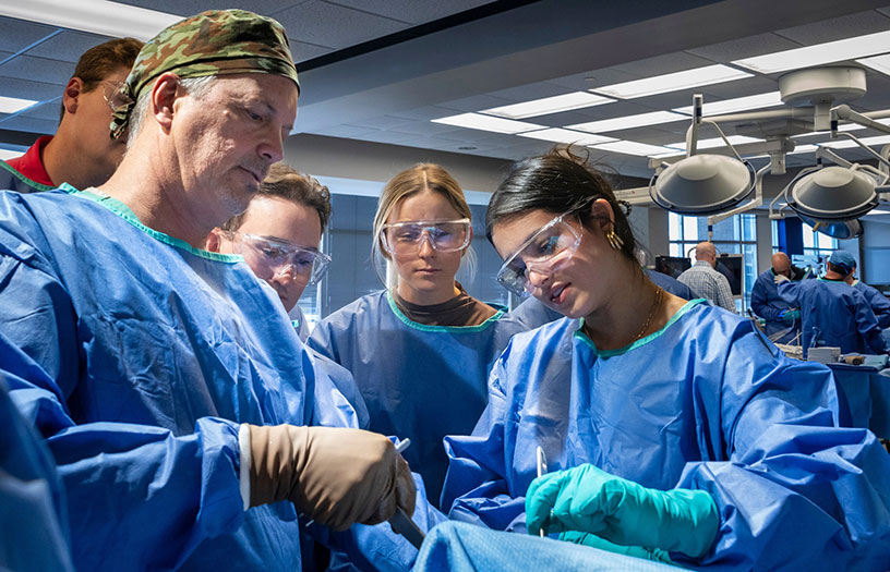 Doctors showing interns latest orthomedical research