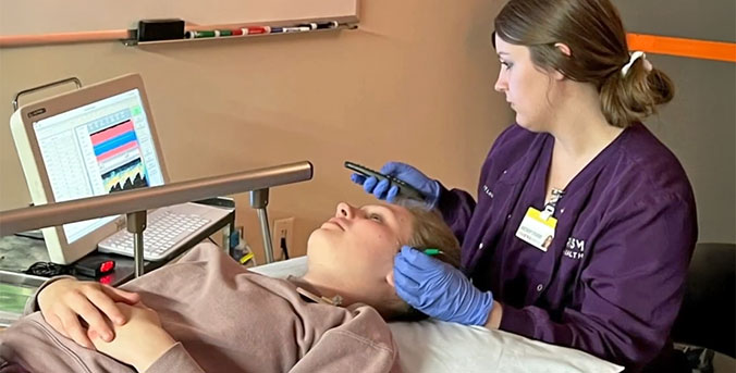Student enrolled in CVT program using equipment on patient