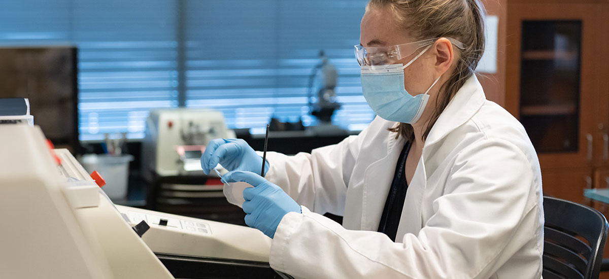 Student using medical lab equipment