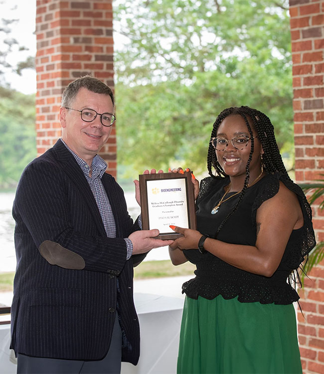 Student award winner accepting plaque