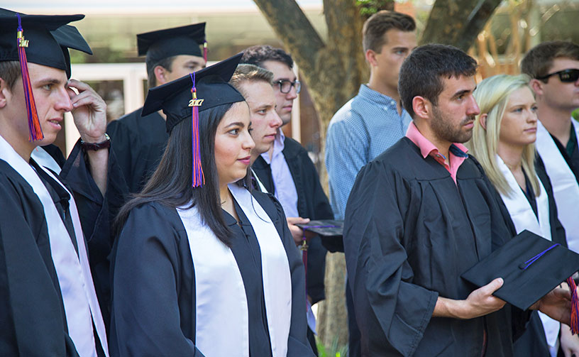 graduates at department gathering.