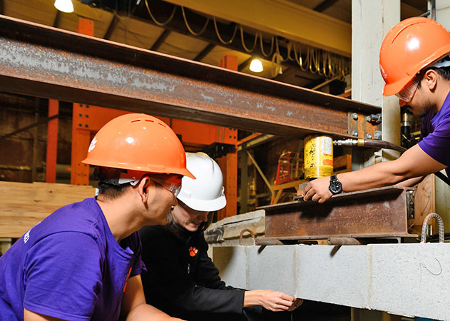 Redmond working with students in masonry research area
