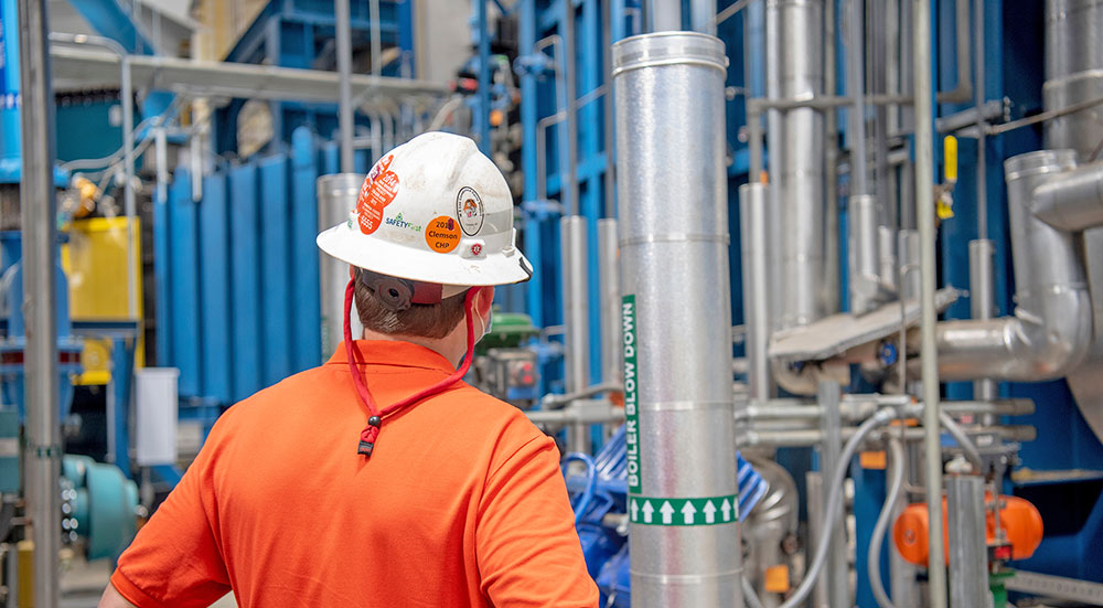 Campus heat and power plant employee during inspection.