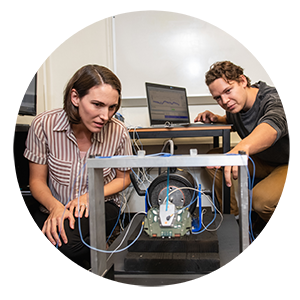 John Bell working with Laura Redmond on PUFFER equipment.