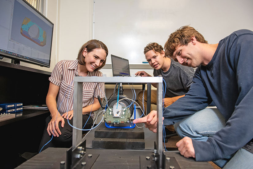 Redmond and graduate students in office.