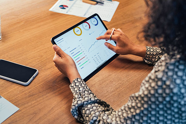 Woman using tablet to view data.