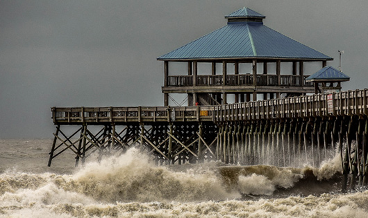 A coastal structure amidst a severe weather event.