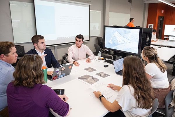 Civil Engineering students and professor planning parking on campus.