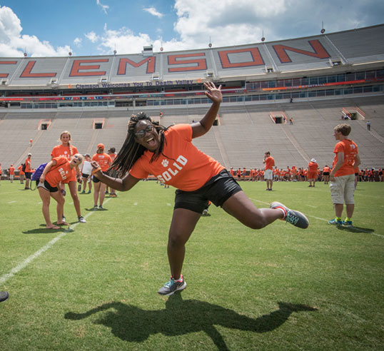 Chem E student on stadium field