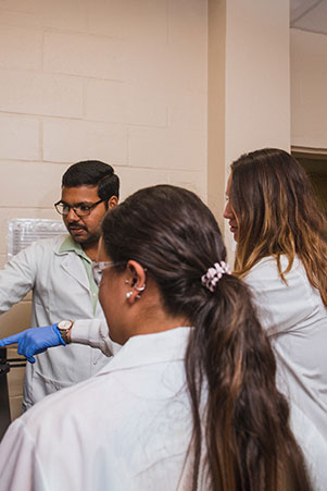 Larsen with 2 graduate students in nanotech lab