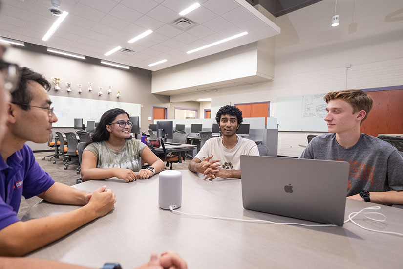 Group gathered around in computer lab space in McAdams