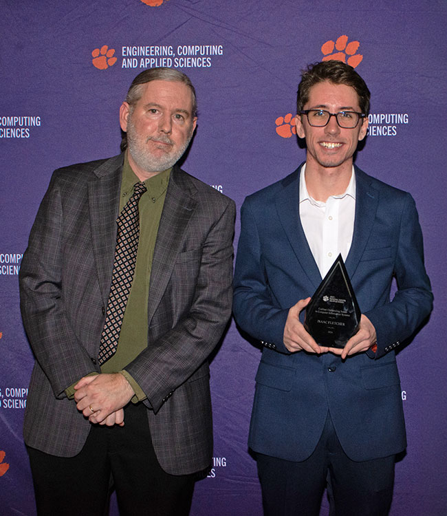 Student award winner accepting plaque