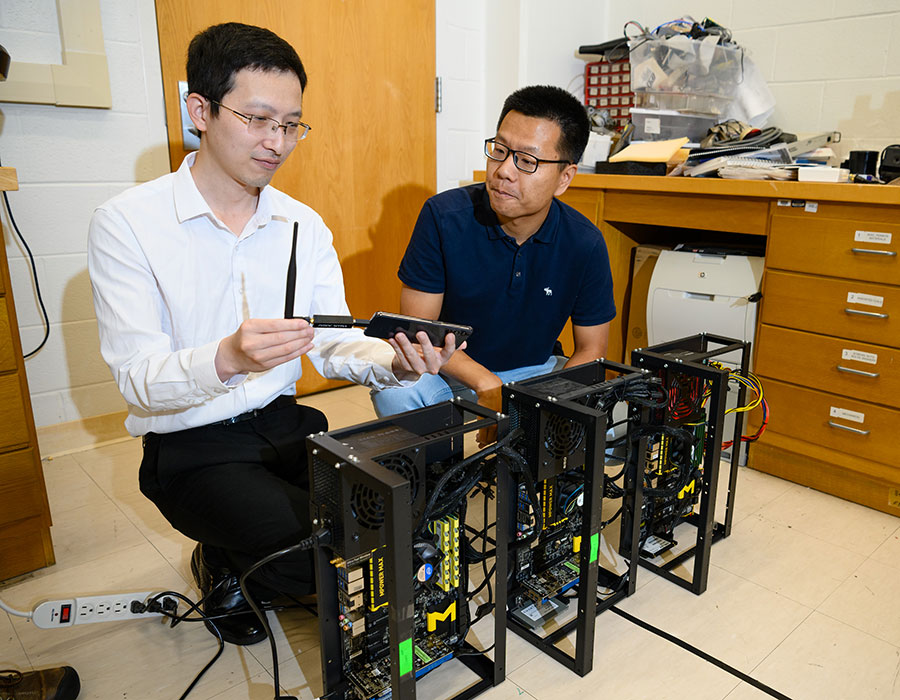 Two in lab space with equipment.