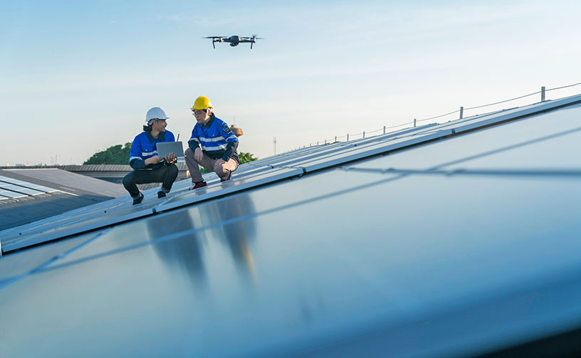 Two engineers on energy panels