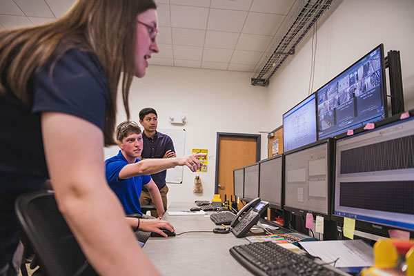 Students viewing information energy on screen