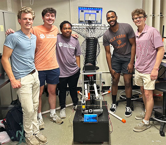 Group of students posing with basketball design