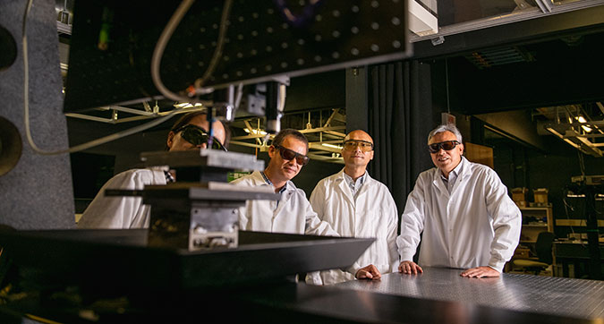Hai Xiao with team members performing energy research