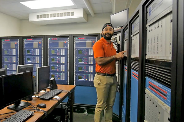 Graduate student in room with servers