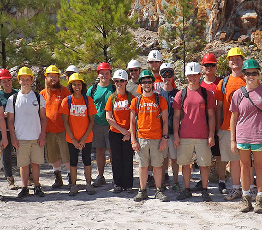 Large group of students on hiking excursion in the mountains.