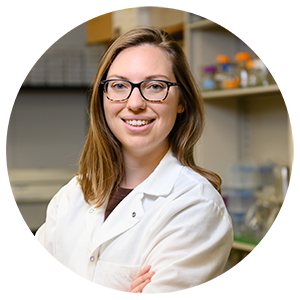 Jessica Deaver in labcoat in lab.