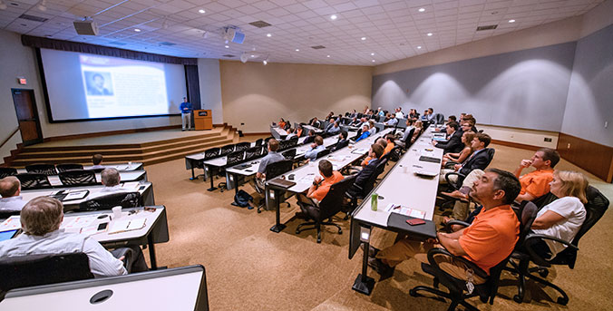 Session in the auditorium at madren Center.