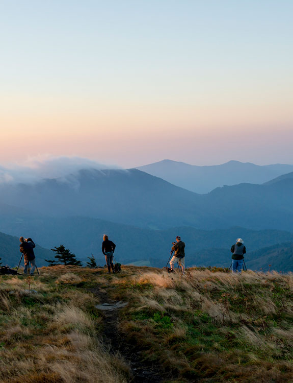 Group overlooking NC Mountain range.