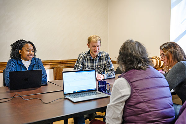 Faculty member and students during writing week