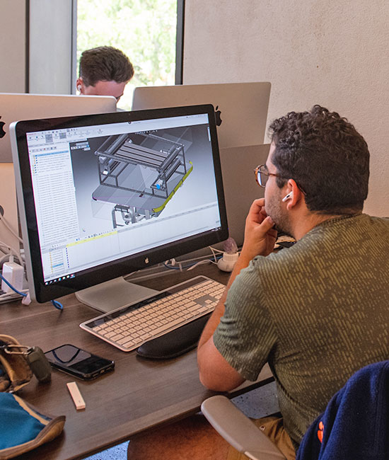 Student using 3D rendering software