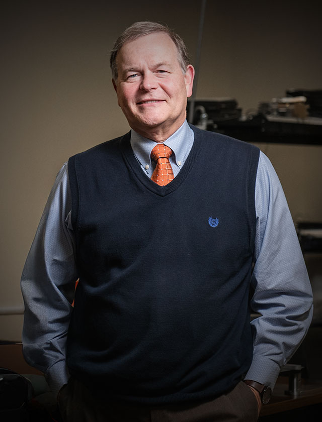 Dr. Watkins in laser research lab.