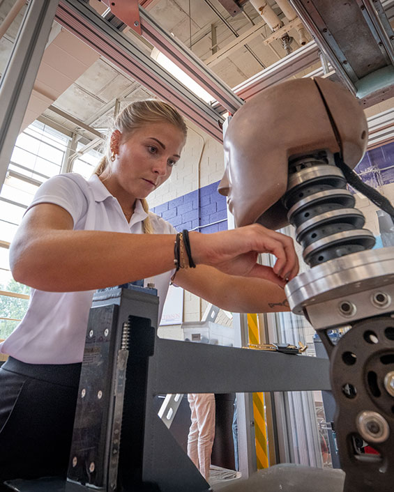 Student in bioengineering CHIP helmet-testing lab