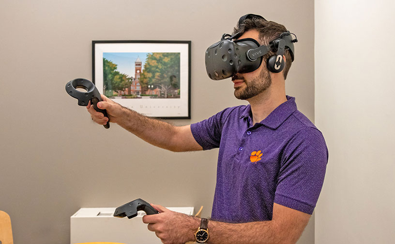 Grad student wearing VR headset.