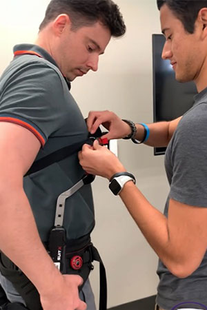 Students putting on ergonomics suit.