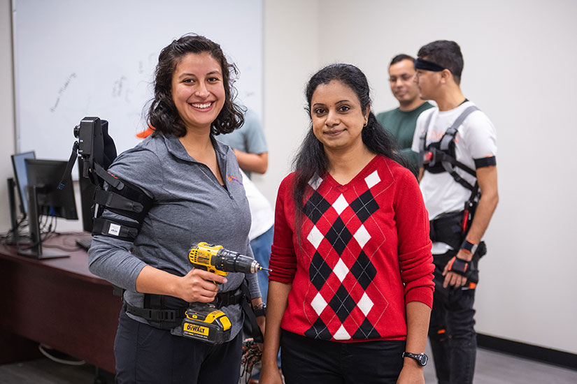 Divya Srinivasan in lab with students